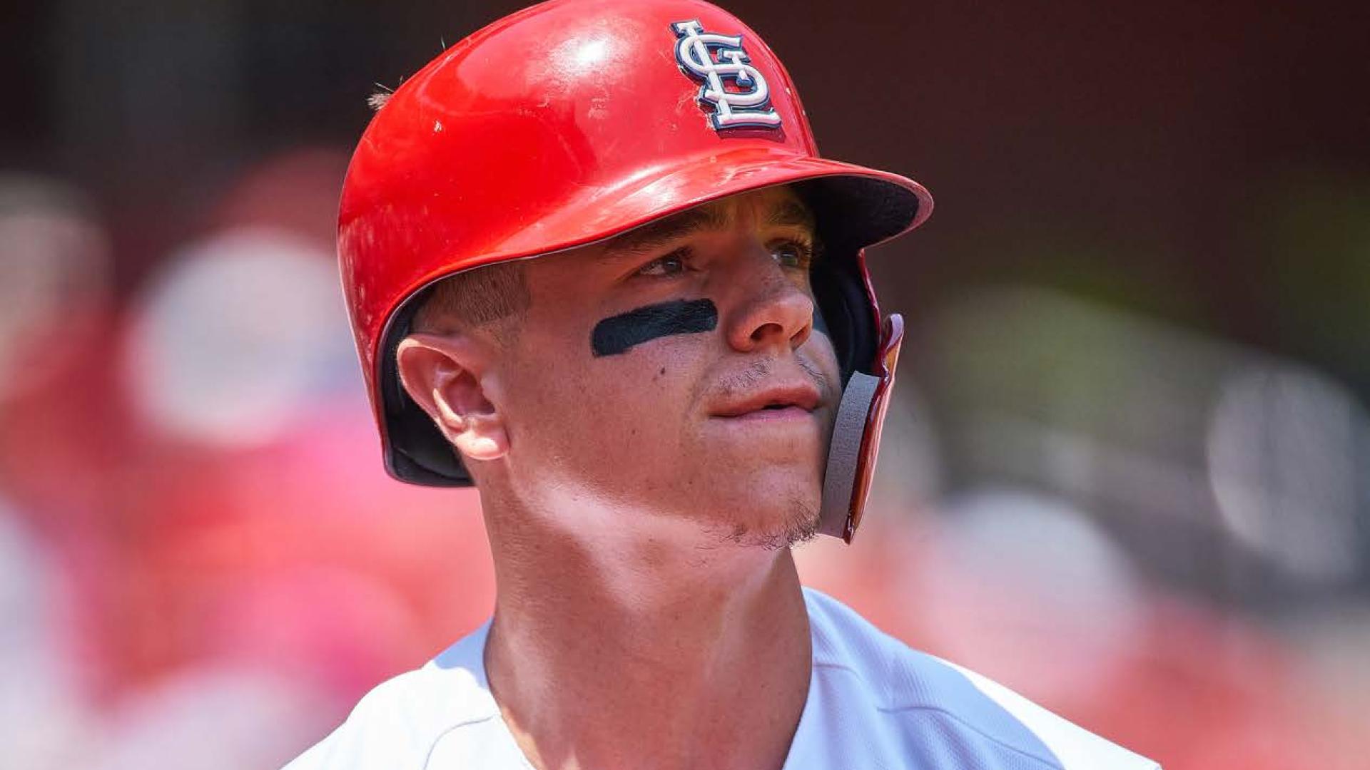 Tyler O'Neill stands in his Cardinals uniform on the baseball diamond.